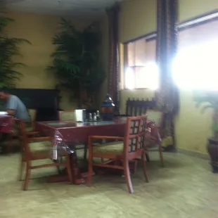 a dining room with a table and chairs
