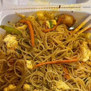 noodles and tofu in a styrofoam container