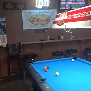 a pool table and bar