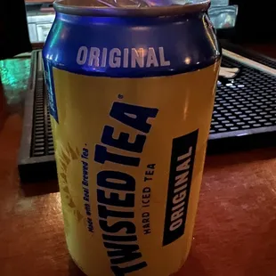a can of beer on a table