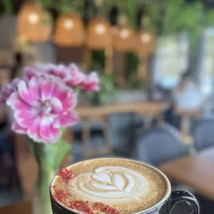 a person holding a cup of coffee