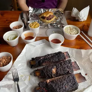 Beef rib, chopped brisket sandwich, spicy corn, beans and coleslaw.