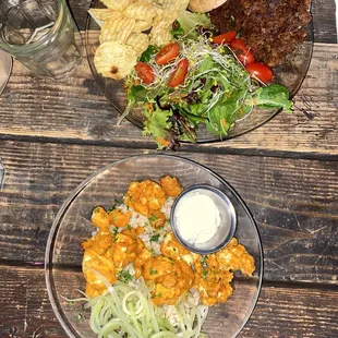 two plates of food on a wooden table