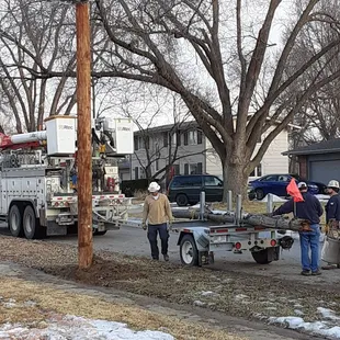 The crew finally cleaning up and taking out the old piece of post off my property