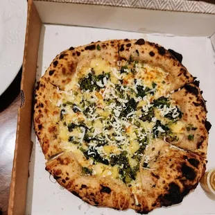 a pizza in a box on a table