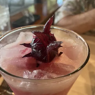 Yummy cocktail with jellied hibiscus flower