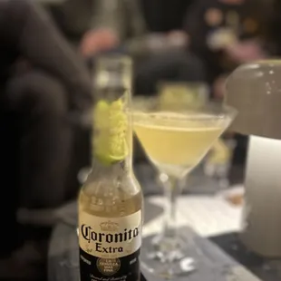a bottle of coronano and a glass of wine