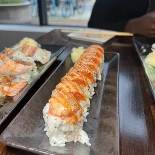 two plates of sushi on a table