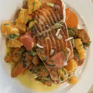 a plate of fish and vegetables