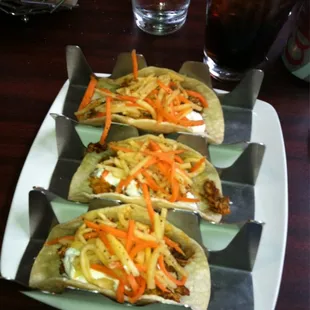 a plate of tacos and chips