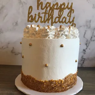 a cake with a happy birthday topper