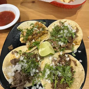 Top left : chicken taco. Top right : fried pork taco. Bottom left : steak taco. Bottom right : barbacoa taco.