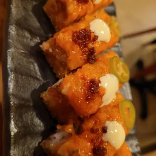 Close up of crispy rice with spicy salmon. Delicious