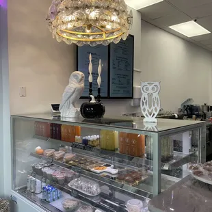 a bakery counter with a variety of pastries