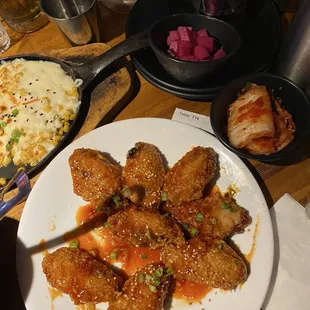 Marinated wings. Slightly sweet, slightly spicy garlicky flavor. All flats and super crunchy despite the sauce coating.
