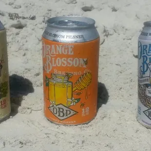 three cans of orange blossom