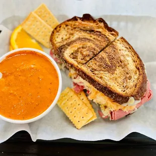 a grilled cheese sandwich and a bowl of soup