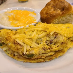Farmhouse omelet with biscuit and cheese grits
