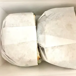 a sandwich in a white box