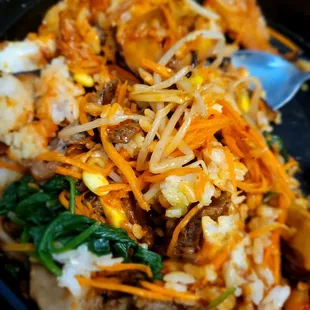 a plate of food with meat and vegetables