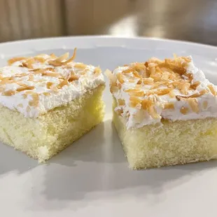two pieces of cake on a white plate