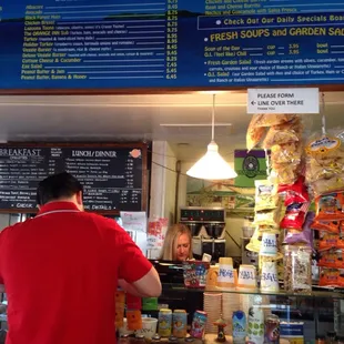 a man ordering food at the counter