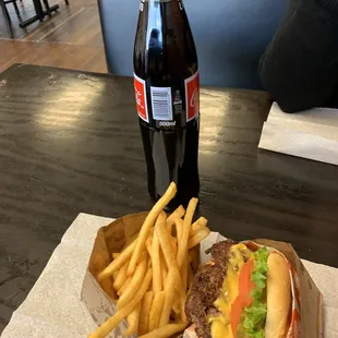 Double cheese burger, fries and Mexican coke.