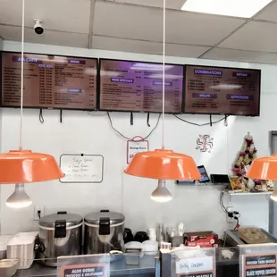 menus on the wall of a restaurant