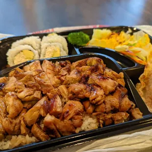 chicken, rice, and vegetables in a plastic container