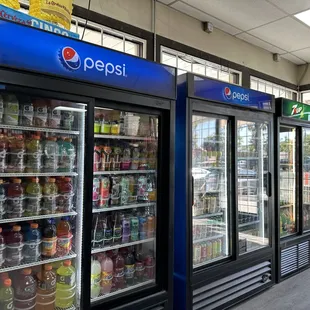 a row of soda coolers