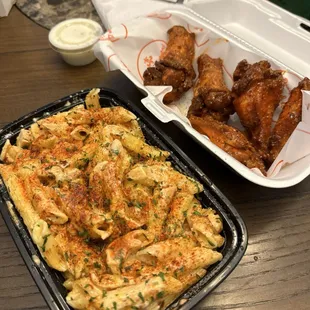 Wings and cajun Alfredo Chicken Pasta