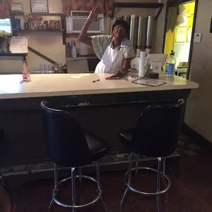 The restaurant's owner, Ms Daisy, telling stories about her basketball days. She told us she had a 32 point average....go Ms Daisy!!!