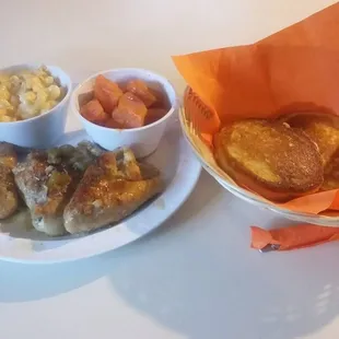 a plate of food and a bowl of macaroni and cheese