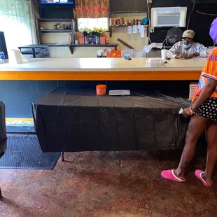 a woman sitting at a counter