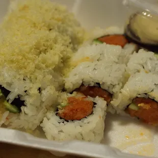 a close up of a container of sushi