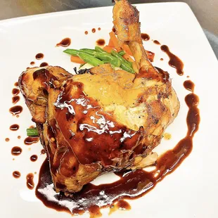 a plate of food with meat and sauce