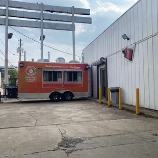 a food truck parked in front of a building