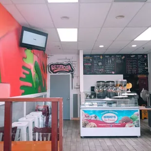 a woman standing in front of the counter