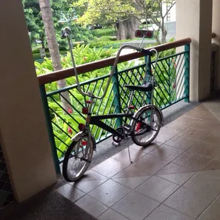 a bicycle parked on a balcony