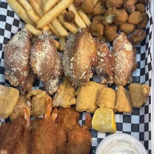 Variety platter with fried okra, Parmesan wings, catfish bites