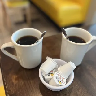two cups of coffee on a table