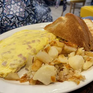 an omelet and potatoes on a plate