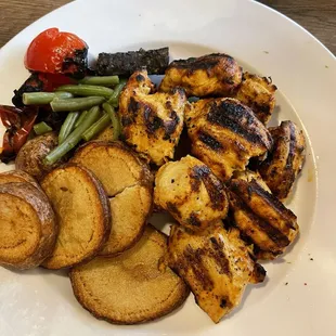 Kabobs, green beans and home style potatoes