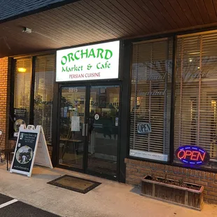 the front of orchard market and cafe