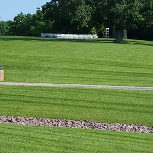 Wedding was outside on the hill, guests transported by tram up the hill. Mid day was fairly shaded under the trees.