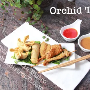 a plate of food with chopsticks