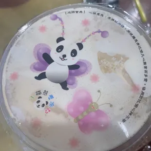 a panda bear drink in a plastic cup