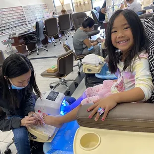 My daughter enjoying her mani and pedi