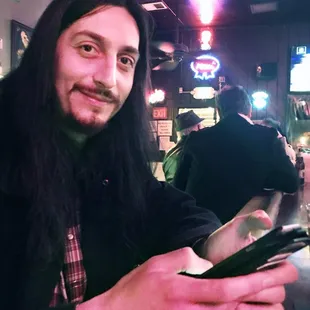 Local artist Anthony Bianconi checking Orchid Room Yelp profile.