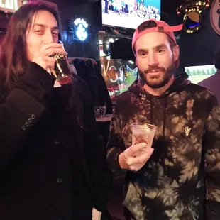 Local artist Anthony Biancony sipping from the winner's glass. Greggy can't believe his game.